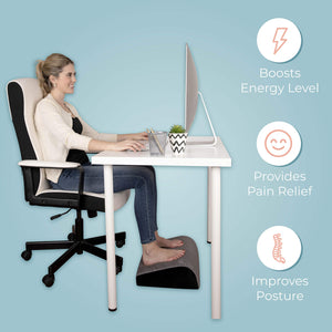 Lady Smiling While While Using Kolbs Foot Rest Pillow